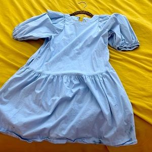 This is a baby blue dress with pockets and is a summer dress